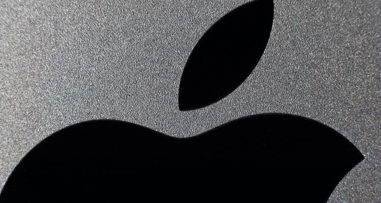 ZAGREB, CROATIA - February 15, 2015: Black Apple logo on brushed aluminium background.